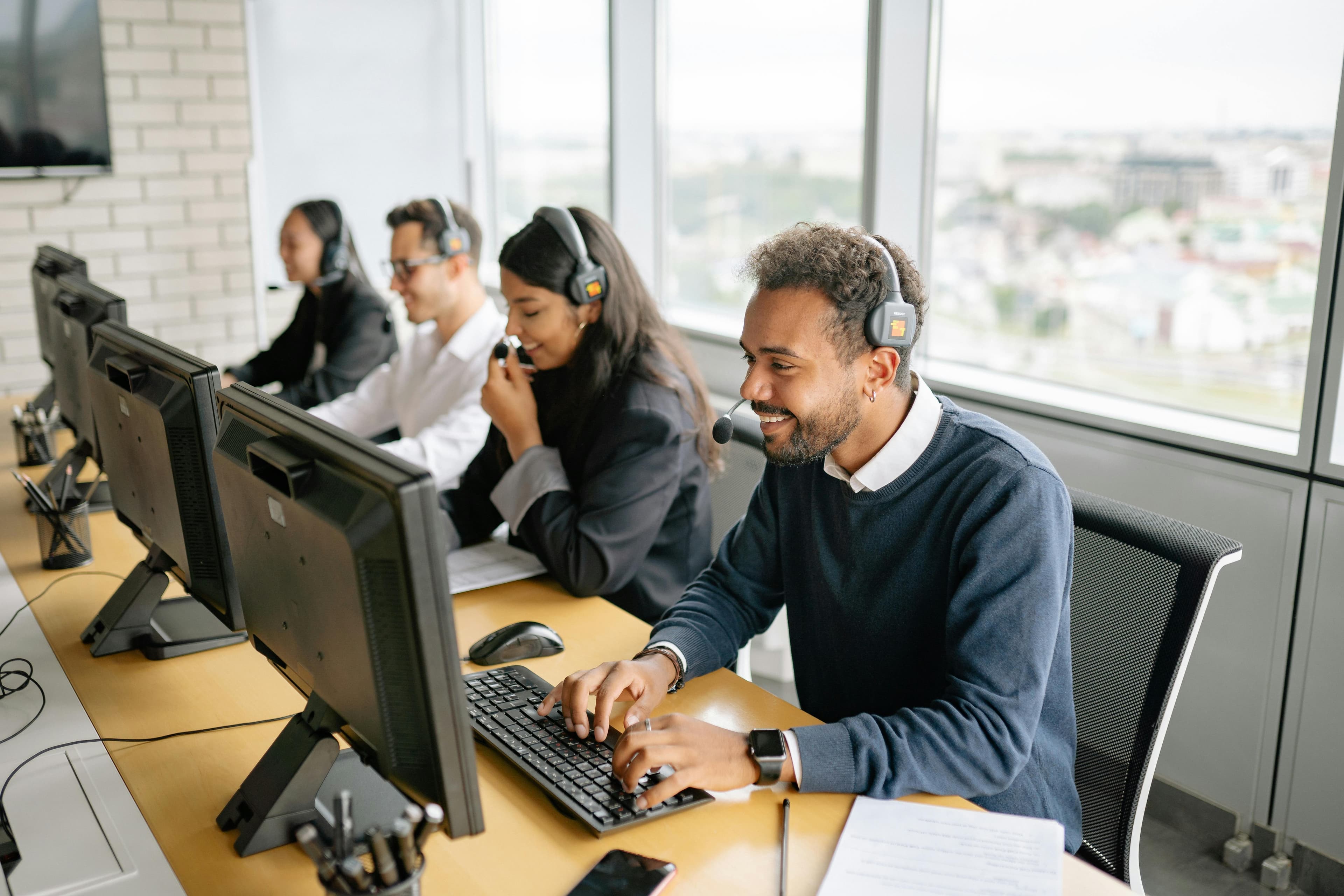 Customer service team working at computers